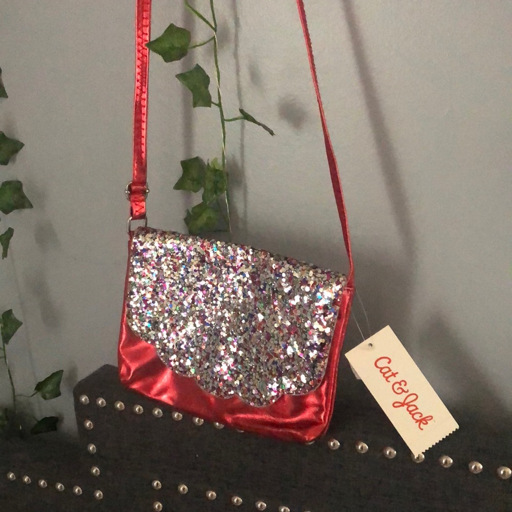Red holographic crossover body bag.